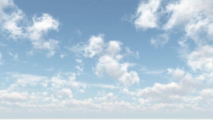 A blue sky with wispy white clouds.